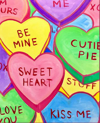 Picture of painted Valentine's candy hearts with cute sayings like "Sweet Heart" and "Be Mine" in several colors